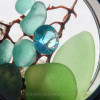 A detail of this locket shows you we use only genuine sea glass and top quality crystals.