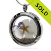 Stunning early 20th century purple or lavender sea glass combined with beach sand ,a baby starfish and sandolllar and brightened up with amethyst gems makes this a great choice for a February Birthday!