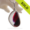 A SUPER ULTRA RARE mixed vivid tourmaline pink color  and deep purple this English sea glass piece  set in our Original Wire Bezel© necklace pendant setting in Sterling Silver.