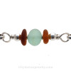 A detail of this Sea Glass Bracelet shows you the perfect seafoam Green Sea Glass Center Bead Accents of amber sea glass.