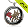 REAL Ruby Red  sea glass are combined with a small and larger starfish in this stainless steel locket necklace. A vivid ruby crystal gem makes t his a great gift idea for anyone with a July Birthday!
