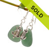 Unusual green sea glass pieces set with solid sterling sea turtles for a lovely pair of sea glass earrings!