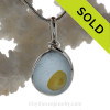 A lovely pale blue sea glass base with a drop of golden yellow in our original WIre Bezel setting.