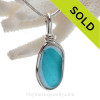 A Lovely Petite Flashed Electric Aqua multi sea glass set in Sold Sterling Silver Deluxe Wire Bezel© pendant setting.