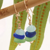 Green sea glass pieces combined with frosted glass beads in cobalt and aqua in a nice stacked earring.