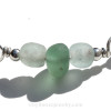 A detail of this Sea Glass Bracelet shows you the perfect seafoam Green Sea Glass Center Bead Accents of amber sea glass.