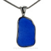 A large piece of rare blue sea glass in a distinctive setting.