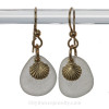 Perfect pieces of beach found white sea glass are combined with 14K Goldfilled shell charms for a simple elegant sea glass earring.