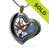 True Purple sea glass in a heart shaped locket with real starfish and brightened up with a amethyst crystal gem. This a great choice for a February Birthday!
