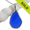 A neat very subtly embossed piece of Cobalt Blue Genuine Sea Glass with in our signature Original Wire Bezel© pendant setting in Sterling Silver.
A neat piece in a shape that was made by nature and is UNLATERED from the way it was found on the beach. This style setting leaves both front and back open and the glass unaltered from the way it was found on the beach.

Many cobalt sea glass pieces come from old bottles and jars like Phillips Milk Of Magnesia, Noxzema and Vicks Jars and Bromo bottles. This color has not been made commercial since the mid 1960's and is increasingly harder to find as every year passes.  