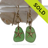 Green sea glass earrings with gold starfish
