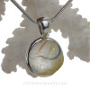 A multi color sea glass marble is expertly set in our Original Wire Bezel© setting.