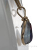 A side view shows you the thickness of this historical sea glass pendant.