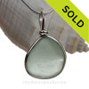 Soft Green beach found glass from is set in our Original Wire Bezel pendant setting in sterling silver