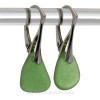 Shaped only by the sea, these unusual vivid green natural sea glass pieces really glow hanging from these solid sterling silver leverback earrings.