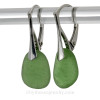 Shaped only by the sea, these unusual vivid green natural sea glass pieces really glow hanging from these solid sterling silver leverback earrings.