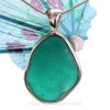  vivid teal sea glass pendant is set in our Deluxe Wire Bezel© pendant setting.
