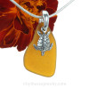 Amber brown sea glass set on a cast solid sterling silver bail with a sterling sea turtle charm.