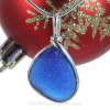 A P-E-R-F-E-C-T piece of beach found glass from Seaham England in a vivid Bright Blue is set in our Original Wire Bezel© pendant setting.