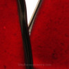 A close up detail of one of the Ruby Red Sea Glass