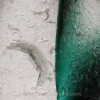 A detail close up of the sea glass used in this jewelry shows the color combinations of this jewelry piece.