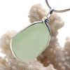 A very bright and light yellowy green sea glass set in our Original Wire Bezel© pendant setting in sterling silver.

This amazing TOP QUALITY sea glass originates from Seaham England and is the result of years of glass factories discarding their scraps into local waters.

Shown here on our 2mm Snake Chain (Not Included - but recommended and available as an upgrade).