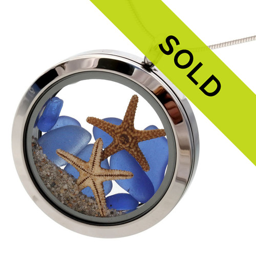 Beautiful blue sea glass combined with two real starfish and beach sand completes the scene!
This locket has been sold