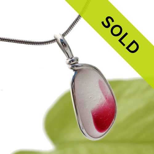 A petite mixed hot pink sea glass from England is set in our Original Wire Bezel© necklace pendant setting.