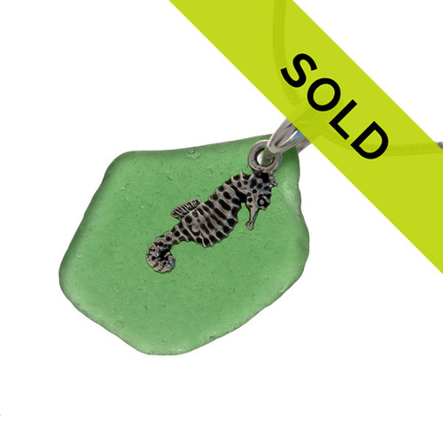 Bright green sea glass set on a solid sterling cast bail with a sterling silver seahorse charm.
The sea glass necklace comes on our 18" solid sterling smooth snake chain (SHOWN and included)