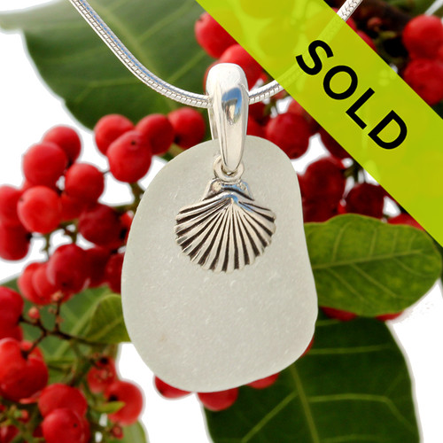 Beach found pure white sea glass is combined with a solid sterling sea shell charm and presented on an 18 Inch solid sterling snake chain.