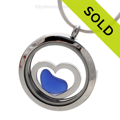 A natural blue sea glass heart combined a large silver heart in this sea glass locket necklace. 
Sorry this Sea Glass Jewelry selection has been SOLD!