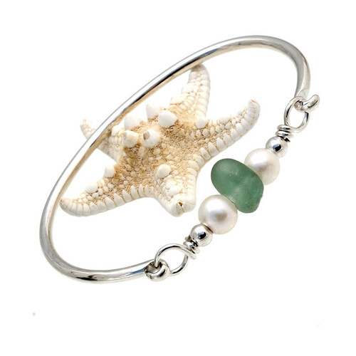 A thick piece of deep seafoam green sea glass combined with genuine fresh water pearls on a solid sterling bangle bracelet.