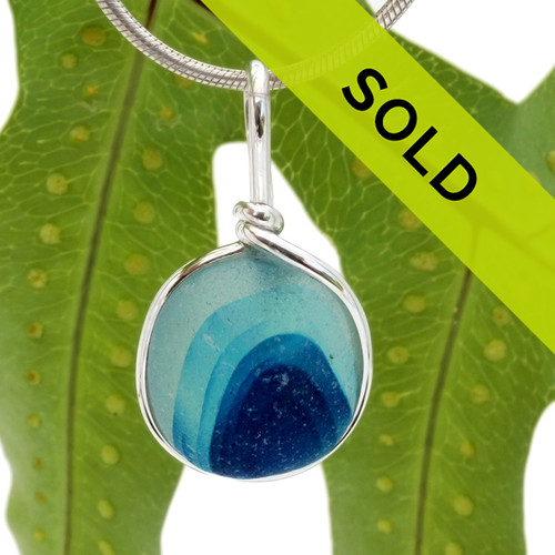 A beautiful piece of vivid aqua and blue green sea glass set for a necklace in our Original Sea Glass Bezel© in solid sterling silver setting.
