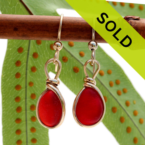 A lovely small pair of Genuine Vivid Red Sea Glass Earrings set in gold in our Original Wire Bezel© setting.
Sorry these earrings are no longer for sale