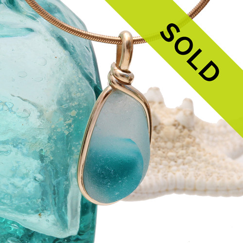 An amazing combination of vivid electric aqua and white or clear in this very old English Sea Glass piece and set in our Original Wire Bezel© necklace pendant setting.
Sorry this piece has sold!