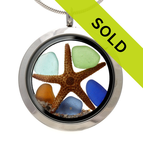 A combo of 5 genuine sea glass pieces in blue, aqua, periwinkle, green and amber sea glass pieces combined with a real starfish in this sea glass locket necklace.
Sorry this sea glass locket necklace has been sold!