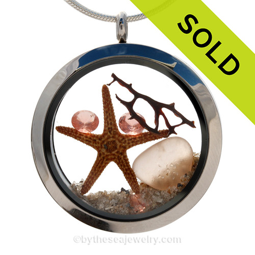 Beautiful and RARE Genuine Peach sea glass pieces combined with a real starfish and pink depression crystal gems. Finished with real beach sand in this JUMBO 35MM stainless steel locket.
SOLD - Sorry this Sea Glass Locket is NO LONGER AVAILABLE!