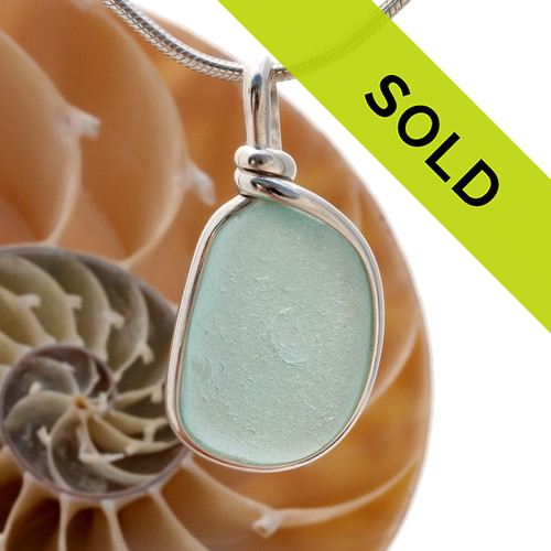 A perfect piece of pale aqua blue sea glass in our Original Wire bezel© necklace pendant setting.