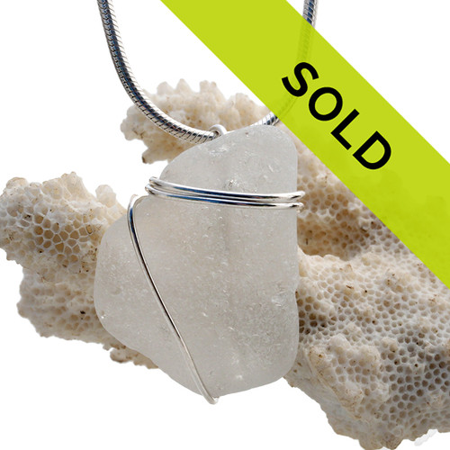 A nice piece of genuine sea glass in white and a simple wire wrapped sterling setting.
Sorry this sea glass jewelry piece has been sold!~