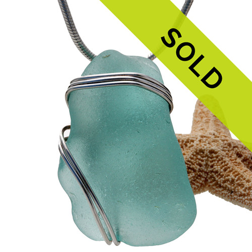 Sorry this sea glass jewelry piece has been sold!
A nice chunky piece of vivid aqua sea glass is set in our secure triple sterling setting.
A great pendant for any necklace.