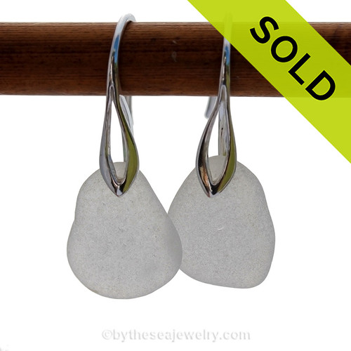 A pair of natural beach found sea glass earrings in a winter white on sterling silver deco hooks.
Sorry this sea glass jewelry selection has been sold!