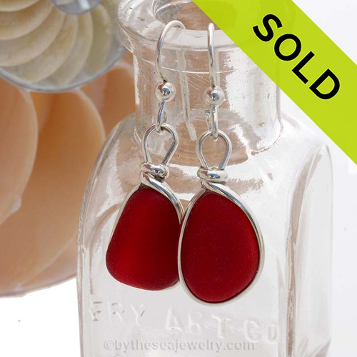 A stunning pair of natural GENUINE red sea glass earrings set in sterling silver.
Sorry this Sea Glass Jewelry selection has been SOLD!