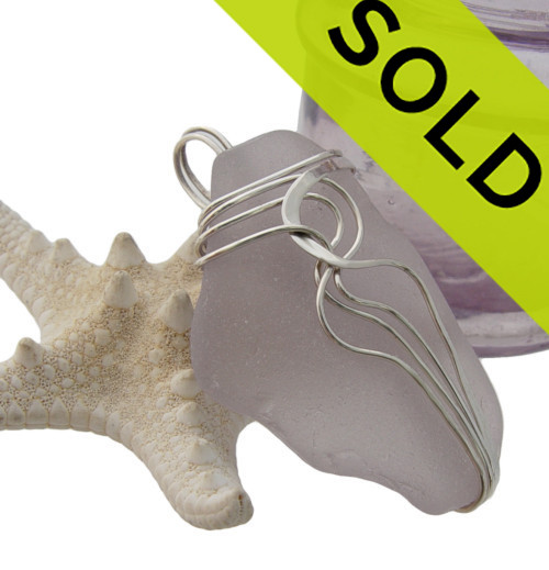 Large purple or lavender sea glass necklace pendant in sterling waves setting.