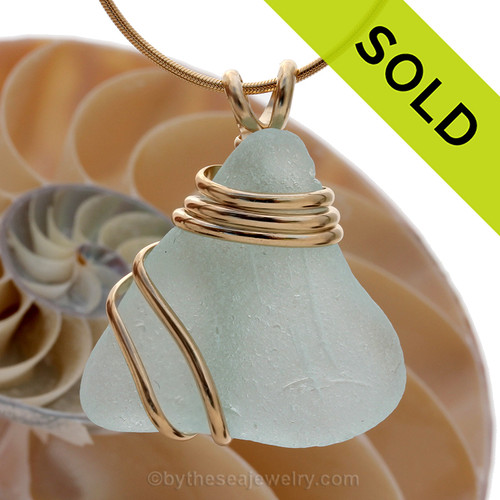 TOP quality piece of long aqua green Genuine Sea Glass set in a triple heavy goldfilled setting that maximizes metal yet leaves much of this great sea glass piece open.
Sorry this piece of sea glass jewelry has been sold!