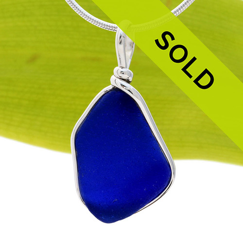 A nice piece of Deep Cobalt Blue with in our signature Original Wire Bezel© pendant setting that leaves both front and back open and the glass unaltered from the way it was found on the beach.
Sorry this sea glass jewelry piece has been sold!