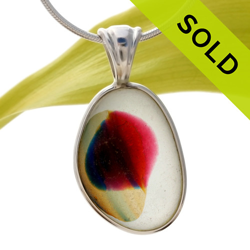 A beautiful and ultra rare mixture of colors fused on a pure white sea glass piece. This piece is set in our Original Wire Bezel© setting and leaves this amazing natural sea glass piece UNALTERED from the way it was found on the beach!
SOLD - Sorry This ULTRA RARE Sea Glass Jewelry Pendant  Is NO LONGER AVAILABLE!