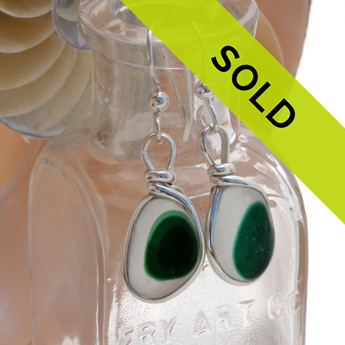 Rare one of a kind sea glass earrings with multi green flashed sea glass from Seaham England.
Sorry this sea glass jewelry selection has been sold!