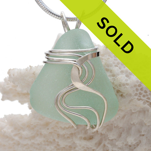 Top quality pale aqua blue sea glass set in our signature WAVES pendant setting.
This setting leaves the sea glass totally UNALTERED from the way it was found on the beach!
Sorry this sea glass jewelry selection has been sold!