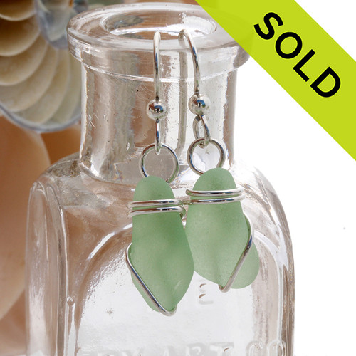 A pair of vivid yellowy seafoam sea glass pieces set in a simple sterling setting.
Sorry this Sea Glass Jewelry selection has been sold!