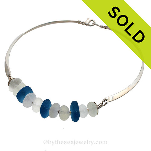 A stunning statement making sea glass necklace with perfect white English sea glass and vivid blue recycled glass beads on sterling.
Sorry this one of a kind Sea Glass Jewelry piece has been SOLD!